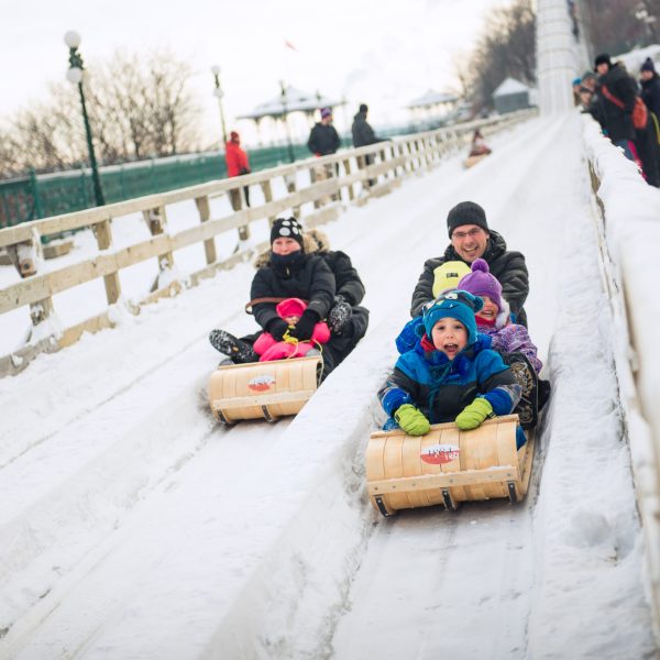 a couple of people that are sitting in the snow