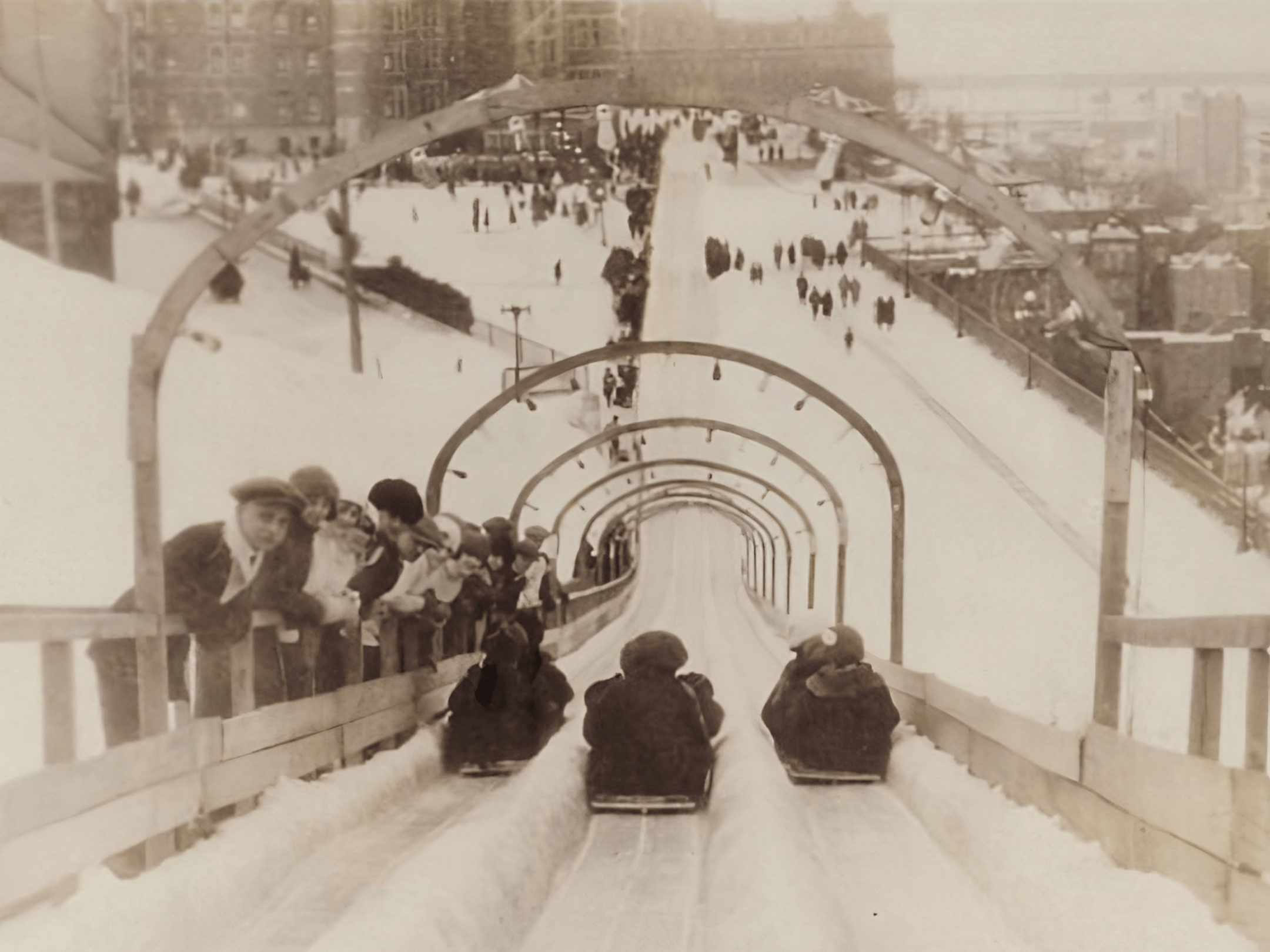 a group of people riding skis on top of a building