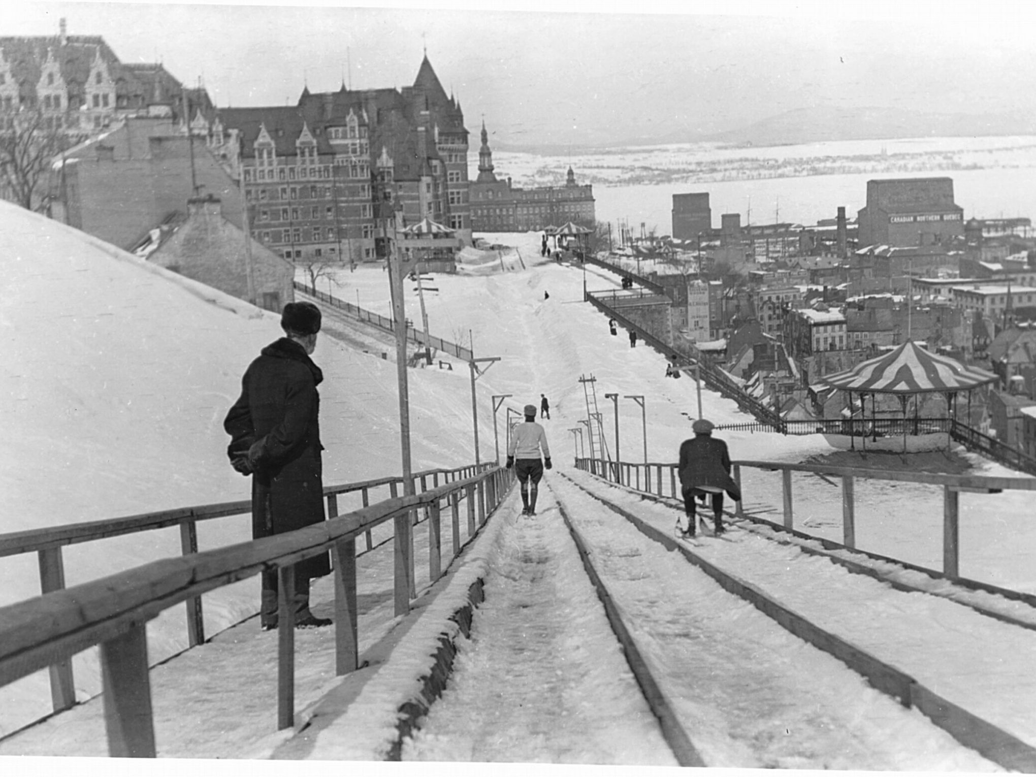 a group of people walking on a bridge