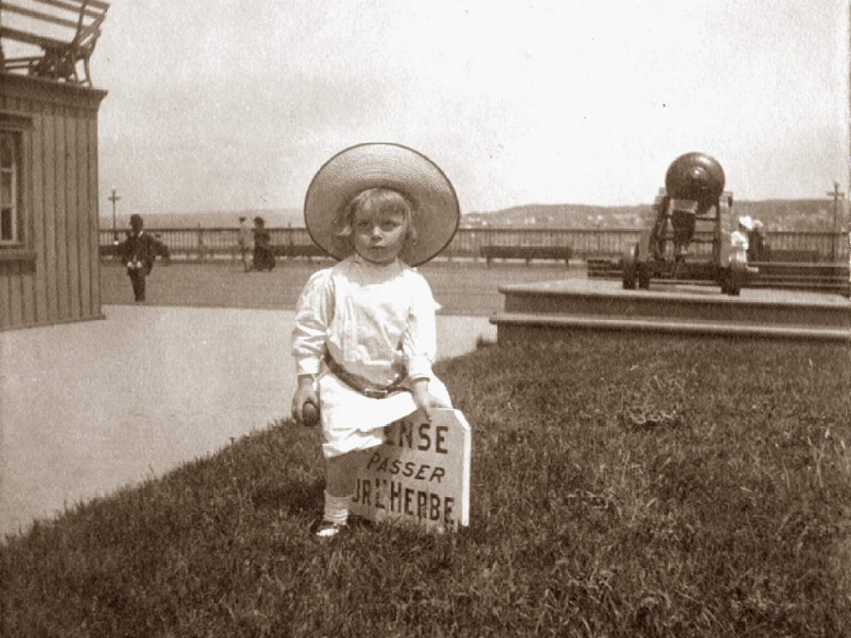 a little boy that is standing in the grass