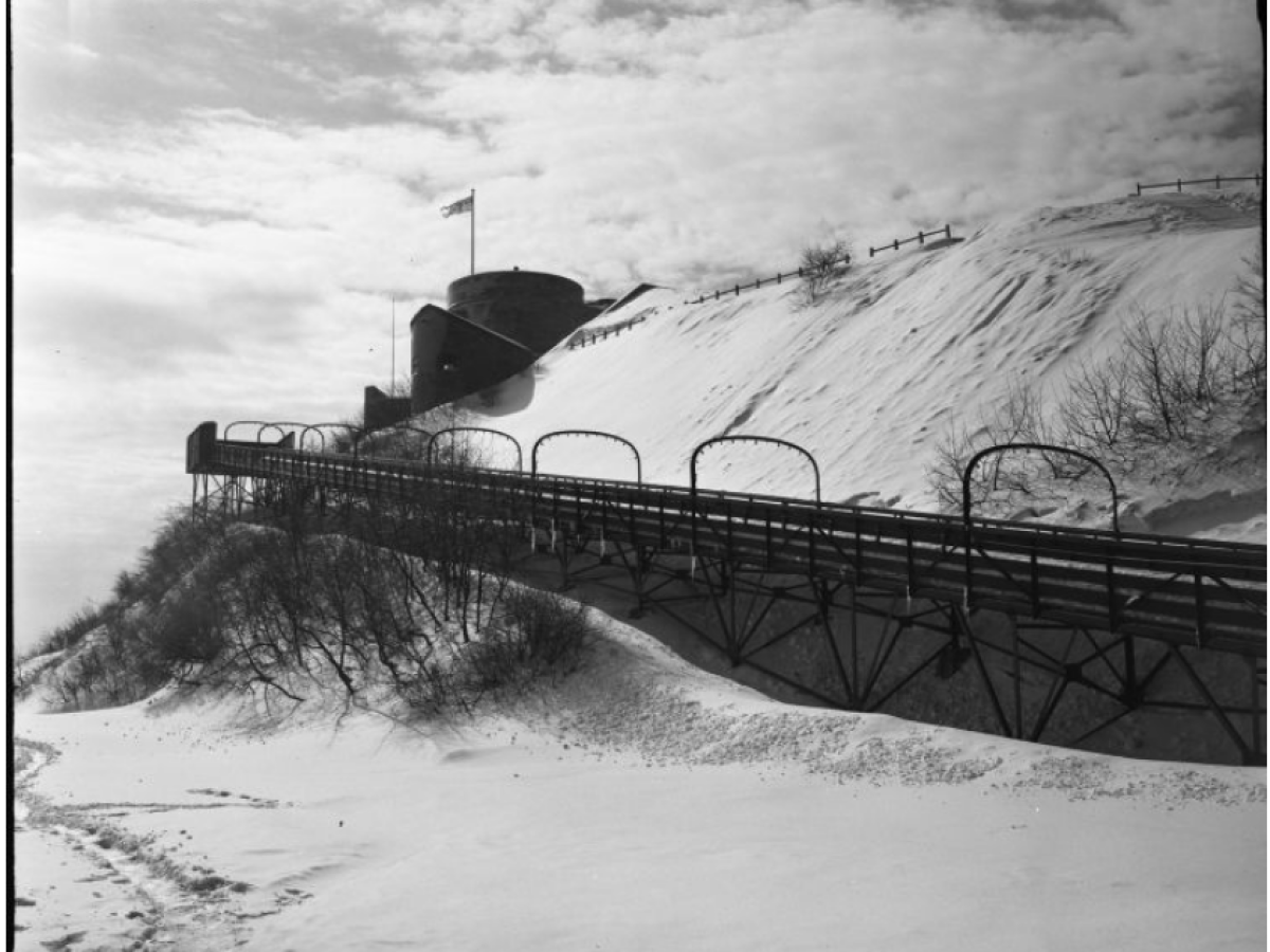 a train crossing a bridge over a river