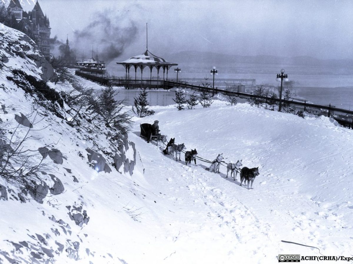 a group of people riding skis on top of a snow covered mountain