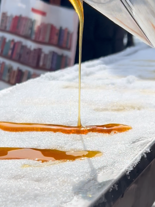Molten liquid pouring onto a snow-covered surface.