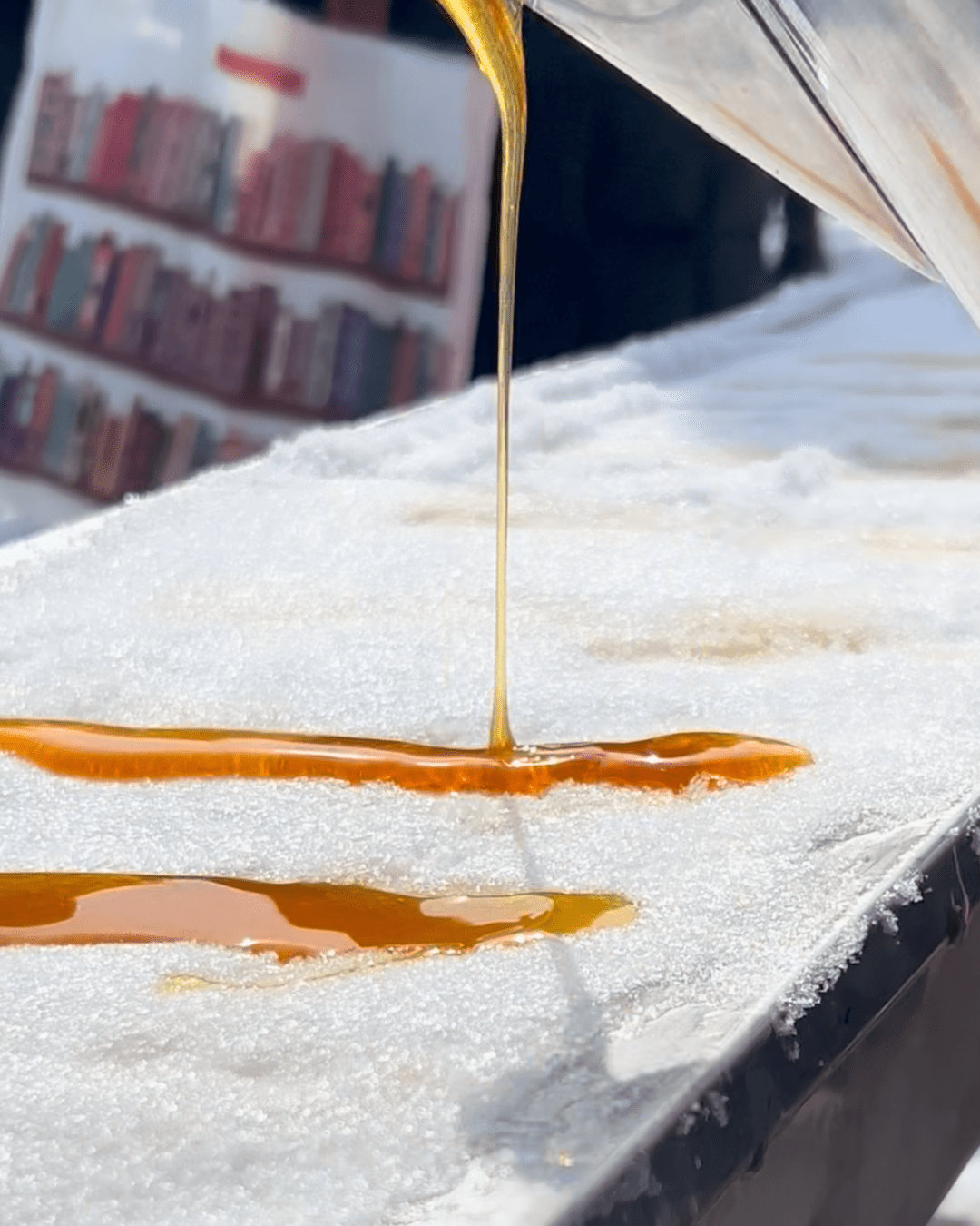 Molten liquid pouring onto a snow-covered surface.